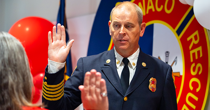 Fire Chief Bergerson holding up his right hand