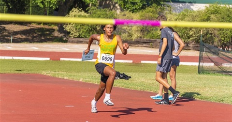 An athlete running on a track representing Team Waco